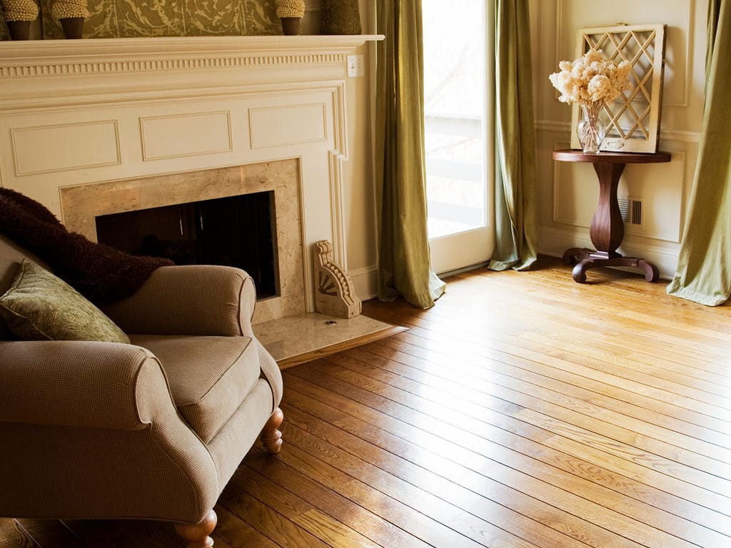 chair-and-fireplace-in-a-nice-living-room-with-white-oak-flooring